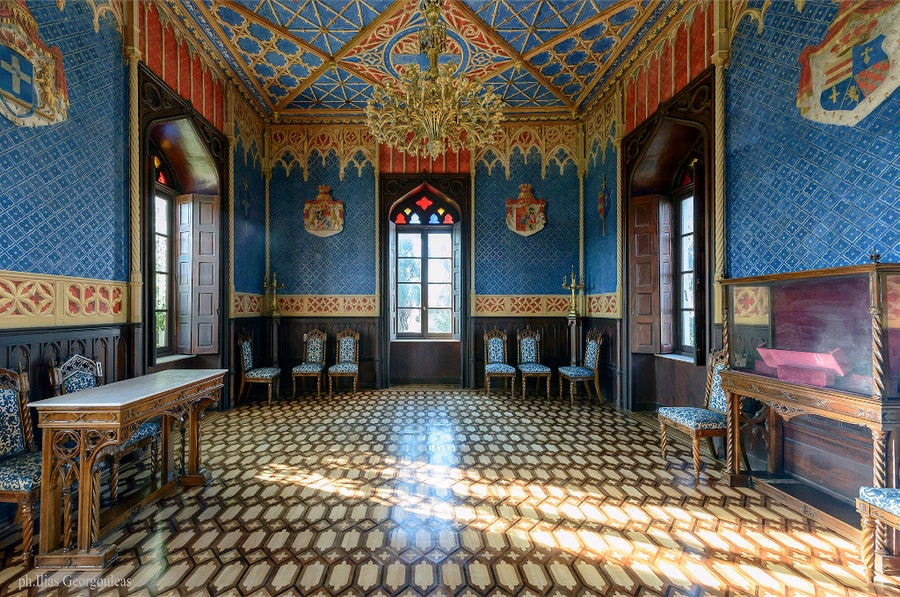 Louis XIV room with chairs and chandelier at Pyrgos Vasilissis winery